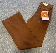 Vintage 1970's Boys brown Fashion Flares denim bellbottom/ Boot cut jeans.  poly/cotton Size 12 Slim, Inseam 25.5", Waist 23.  These jeans are original 1970's deadstock, unworn with original tags! Vintage Flare Bottoms For Fall, Vintage Flare Pants For Fall, Vintage Fitted Flare Jeans For Fall, Fall Vintage Fitted Flare Jeans, Vintage Stretch Pants For Fall, Retro Brown Jeans For Fall, Retro Brown Fall Jeans, Brown Retro Fall Jeans, Vintage Brown Flare Bottoms