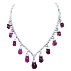 An exquisite Tourmaline Rubellite and Diamonds necklace , sparkled with elegance, catching the light and reflecting vibrant light . Interspersed with dazzling diamonds , the necklace exuded luxury and sophistication . It was a piece that demanded attention and admiration whenever it was worn. Add a touch of elegance and glamour on your look. Magnificent necklace come in 18k gold with 11 pieces Natural Tourmaline Rubellite , in perfect drop cabochon cut , of 77,00 carats, fine quality, and Natural Diamonds of 6,50 carats, F color VS clarity, very sparkly. Handcrafted by artisan goldsmith. Complete with AIG report. Extremely HIGH Product. Wholesale Price. Shop with Confidence. We offer free worldwide shipping , taxes free on my shipment. Expensive Jewelry Luxury, Diamonds Necklace, 18k Gold Necklace, Big Diamond, Jewelry Luxury, Expensive Jewelry, Multi Strand Necklace, Multi Strand, Tourmaline