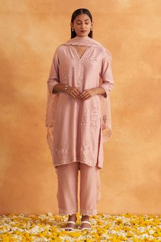 Pastel pink kurta with floral embroidery and lace border detailing. Paired with pant and organza dupatta.
Components: 3
Pattern: Embroidered
Type Of Work: Floral
Neckline: Notched
Sleeve Type: Three quarter
Fabric: Kurta: Chanderi, Bottom: Chaneri, Dupatta: Organza
Color: Pink
Other Details: 
Lace detailing
Side slits
Attached lining
Occasion: Puja - Aza Fashions Unstitched Pink Pant Set With Chikankari Embroidery, Pink Bollywood Pant Set With Chikankari Embroidery, Elegant Pink Designer Pant Set, Pink Chikankari Embroidery Pant Set For Wedding, Pink Chikankari Embroidered Wedding Pant Set, Pink Chikankari Embroidered Pant Set For Wedding, Pink Pant Set With Resham Embroidery For Eid, Pink Pant Set With Resham Embroidery For Wedding, Designer Pink Pant Set For Festive Occasions