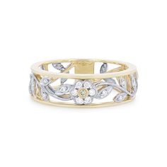 a yellow and white gold ring with flowers