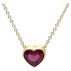 This gorgeous heart-shaped pink rubellite tourmaline necklace is simply dazzling! It features a 1.99 carat striking gem with vivid hot pink color, set in a custom-made 18k yellow gold bezel and suspended on a classic and elegant 18k yellow gold chain. The pendant measures approximately 3/8" in diameter, and the necklace can be adjusted from 16.5 to 18 inches for wonderful versatility! Stunning for both daytime and evening wear. What better way to show your affection than with this timeless expre Bezel Necklace, Rubellite Tourmaline, Hot Pink Color, Tourmaline Necklace, Yellow Gold Chain, Drop Necklace, Color Rosa, Color Set, Evening Wear