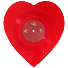 a red vinyl record in the shape of a heart