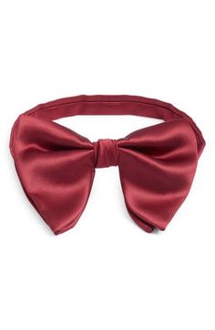 Smart and simple, this bow tie crafted from jewel-tone silk comes pre-tied with a small knot that emphasizes its classic shape. Pre-tied; adjustable 100% silk Spot clean Made in the USA of imported fabric Classic Pre-tied Butterfly Knot Bow Tie, Classic Pre-tied Satin Bow, Elegant Solid Bow Tie, Elegant Pre-tied Adjustable Bow Tie, Elegant Adjustable Pre-tied Bow, Classic Adjustable Satin Ties, Elegant Solid Color Bow With Tie Back, Elegant Pre-tied Bow For Gift, Elegant Solid Color Bow