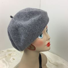 This is a classic French beret in a medium heather gray fine wool, It is made of 100% wool that was knitted and felted then hand blocked and shaped by me in my studio. This one is warm and soft with enough body to give it form yet easy to wear anywhere. It is partially lined to protect your hair. The sizes on my berets are flexible. This one will fit head sizes 22 to 23.5 If you need it blocked slightly larger, just let me know. Thank you for shopping and thank you for being a Fabulous Woman! Fitted Gray Wool Hat, Casual Gray Winter Beret, Casual Fitted Wool Beret, Classic Fitted Winter Beret, Classic Fitted Wool Beret, Fitted Wool Beret In Casual Style, Classic Gray Beret For Winter, Classic Fitted Beret For Winter, Casual Gray Beret For Fall