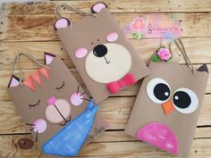 three brown paper bags with animals on them