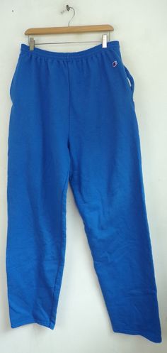 "-Description- >Champion bright blue sweatpants >elastic waist >drawstring at the waist >open bottom >size XL >awesome! >condition: great - name written on the interior tag >color(s): blue >fabric(s): 50 cotton / 50 polyester >brand: champion >care: machine wash -Measurements- >size: XL ✩ all measurements are taken with the item laying flat & some sizes are estimates so please check measurements ✩ waist: 32-35\" / 81-89cm inseam: 33\" / 84cm rise: 16\" / 4 Blue Stretch Cotton Joggers, Blue Full-length Sportswear Sweatpants, Blue Full-length Sweatpants For Sportswear, Blue Full Length Sportswear Sweatpants, Blue Sweatpants With Elastic Waistband For Jogging, Blue Stretch Cotton Sweatpants, Blue Cotton Sportswear Joggers, Blue Sweatpants For Jogging, Blue Cotton Sportswear Pants