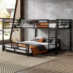 a bunk bed with two sets of beds underneath it and a rug on the floor