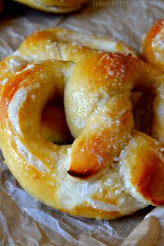 some pretzels are sitting on wax paper