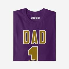 He’s not just your dad, he’s the best one around! A dad as amazing as yours deserves a shirt that shows off his favorite team. Make sure everyone knows how great of a dad and fan he is with this Baltimore Ravens #1 Dad T-Shirt. This top features a design that showcases your all-important team colors and a bold team logo display across the chest, meaning this t-shirt will prove your unmatched dedication to the Baltimore Ravens when you’re at the game or watching at home with your #1 family. In ot Game Day T-shirt With Team Name For Father's Day, Team Name T-shirt For Game Day On Father's Day, Game Day Team Spirit T-shirt For Father's Day, Team Name T-shirt For Game Day, Father's Day Team Spirit T-shirt With Crew Neck, Father's Day Team Spirit Crew Neck T-shirt, Father's Day Fan Apparel T-shirt With Team Name, Father's Day Team Spirit Tops With Team Name, Father's Day Team Spirit Graphic T-shirt