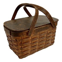 an old wooden basket with handle on white background