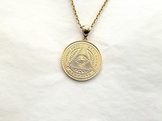 women's and men's circle eye of providence necklace pendant 1 25.5mm made in 14k or 18k solid goldthis is large version of 14k, 18k eye of providence necklace 1 that the diameter is 25.5mm.eye of providence that also known as all-seeing eye of God is a symbol that depicts an eye.each side of it has different design with exquisite details.model wears a 2.1mm 50cm chain.free shipping on all orders!14k gold eye of providence necklace weightpendant only 8.38g (±7%)with a 2.1mm 42cm chain 14.13g (±7% 14k Gold Medallion Amulet Jewelry, 14k Gold Coin Jewelry Stamped 14k, Classic 14k Gold Jewelry With Coin Pendant, Classic 14k Gold Coin Pendant Jewelry, Symbolic 14k Gold Medallion Jewelry, 14k Gold Amulet Medallion Jewelry, 14k Gold Amulet Jewelry With Coin Pendant, Spiritual 14k Gold Medallion Jewelry, Symbolic 14k Gold Star Of David Jewelry