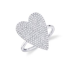 a heart shaped ring with diamonds in the middle and two rows of pave stones on each side