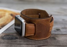 "Premium Leather Apple Watch Cuff Band 38mm-40mm-41mm-42mm-44mm-45mm. Perfectly fits all Apple Watch Series 7 6 5 4 3 2 1 SE (Apple Watch & Sport & Edition Version) Easy Installation- Quick and easy installation. Slid in - Slid out installation. No additional tool is required [Band Size] This watch band is medium size and fits between 150mm(5.9 inch) and 200mm (7.9 inch) wrists. Long Track: Wide: 0.86\" (2.2 cm), Length: 4.68\" (11.9 cm) Short Track: Wide: 0.86\" (2.2 cm), Length: 2.71\" Cuff Watch Band With Bracelet Strap As Gift, Cuff Bracelet Strap Watch Band Gift, Gift Cuff Watch Band With Bracelet Strap, Adjustable Cuff Watch Band For Everyday Use, Apple Watch Cuff, Leather Watch Cuff, New Apple Watch Bands, Personalized Leather Gifts, Apple Watch Bands Women