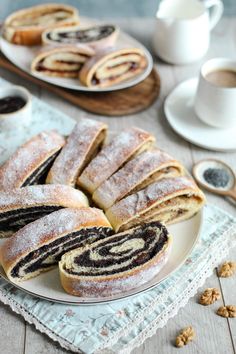 several pastries on a plate with coffee in the background