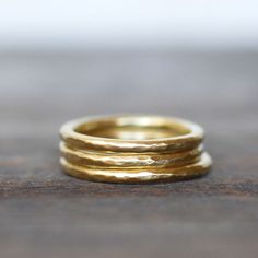 "Elegant and modern yellow gold wedding band. I hand forged the ring out of substantial 2mm gold. This is the perfect wedding band for someone who wants a timeless and elegant look, or a luxurious stacking ring if you feel like treating yourself! Details: Band - 2mm full round Gold - 14k yellow gold - eco-friendly recycled Finish - Brushed satin. Also available with a \"Shiny polished\" finish upon request...otherwise your ring will arrive with the brushed finish. **Please note the photos are en Solid Gold Wedding Band, 14k Gold Wedding Ring, Yellow Gold Wedding Band, Gold Wedding Ring, Hammered Gold, Handmade Rings, Gold Wedding Rings, Recycled Gold, Gold Wedding Band