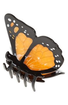 Tame your tresses with a fluttering butterfly jaw clip rendered in a brilliant hue. Plastic/metal Imported