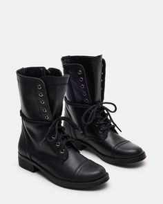 The TROOPA3.0 boot features a combat moto design, adding a stylish edge to your look. These booties are built to last and provide long-lasting comfort. Perfect for those who want to make a statement while still prioritizing practicality. 1 inch heel height 10.5 inch shaft circumference 7.75 inch shaft height Leather upper material Synthetic lining Synthetic sock Synthetic sole Imported Fall Combat Boots With Reinforced Heel And Medium Width, Fall Combat Boots Medium Width High Ankle, High Ankle Combat Boots With Reinforced Heel For Fall, Fall High Ankle Combat Boots With Reinforced Heel, Edgy Combat Boots With Reinforced Heel For Winter, Edgy High Ankle Combat Boots For Fall, Edgy Lace-up Combat Boots For Fall, Fall Lace-up Moto Boots With Lug Sole, Black Combat Boots With Lug Sole For Fall