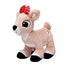 a small stuffed animal with a red bow on its head