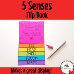 the five senses flip book is shown with markers and pencils on top of it