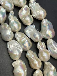 AA natural baroque pearl bead. Natural freedom shape. About 15-30mm . Beautiful natural white color baroque pearl. Beautiful shape . 15.5"   Guaranteed 100% natural baroque fresh water pearl bead. Beautiful natural shape. Beautiful natural white color. Great for craft jewelry making and beading!  Number of beads per strand  15x18mm - 15x30mm 15.5"  approx from about:13beads - 17beads per strand (beads size small or large )  Strand length: approximately 15.5"  Bead size hole: 0.8mm We ship everyday of the week form Monday-Saturday. We will do our best to ship your order the same day or the next business day once your payment is received.  Costumer satisfaction is always our priority and we are committed to give you the best service! Please feel free to email us for any questions, concerns o Craft Jewelry, Fresh Water Pearl, Natural Shapes, Natural Beads, Natural Pearls, Baroque Pearls, Last Minute Gifts, Pearl Beads, White Color