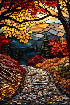 a stained glass window depicting a pathway in the woods with trees and leaves on it