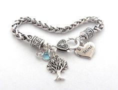 "The beautiful Family Tree Keepsake Bangle Bracelet is the perfect gift for moms, Mimi & Grandmothers. You get to choose the name charm (example: Mother, Grandma, Mom, ect) and how many birthstones that you would like. Comes with Carved tree charm. Please add the birthstone colors (months) you would like in note to seller at checkout. Adjustable, Expandable Bangle Bracelet in Stainless steel. (Fits 7-8\" Wrist) Each item comes nicely packaged in a baby blue organza bag, ready for gift giving Mother's Day Birthstone Charm Bracelet, Mother's Day Birthstone Charm Bracelet For Anniversary, Mother's Day Anniversary Charm Bracelet With Birthstone, Mother's Day Anniversary Birthstone Charm Bracelet, Mother's Day Round Birthstone Charm Bracelet, Charm Bracelet For Mother's Day Gift, Mother's Day Charm Bracelet Gift For Mom, Spiritual Nickel-free Bracelets For Mother's Day, Spiritual Silver Charm Bracelet For Mother's Day