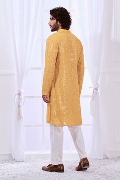 Honey yellow straight kurta with tonal chikankari embroidery highlighted with mirror like work. Comes with contrasting solid pyjama. - Aza Fashions Yellow Chanderi Sherwani With Chikankari Embroidery, Designer Yellow Sherwani With Dabka Work, Yellow Sherwani With Dabka Work For Designer Wear, Yellow Sherwani With Gota Work Straight Kurta, Yellow Sherwani With Gota Work In Straight Kurta Style, Yellow Sherwani With Gota Work And Straight Kurta Shape, Yellow Sherwani With Gota Work, Yellow Sherwani With Gota Work For Navratri, Yellow Sherwani With Chikankari Embroidery For Navratri