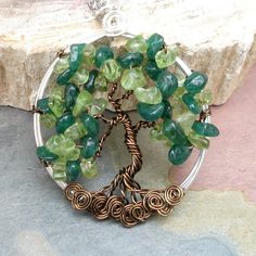 Tree of Life Necklace by SunVDesigns which I now own! Wire Wrapped Pendant Necklaces For May Birthstone, Jade Wire Wrapped Pendant Jewelry, Green Freeform Jewelry For Gifts, Green Wire Wrapped Pendant Jewelry, Nature-inspired Wire Wrapped Crystal Pendant Necklaces, Green Wire Wrapped Pendant, Green Spiritual Wire Wrapped Jewelry, Handmade Green Peridot Necklaces, Green Wire Wrapped Necklace For Gift