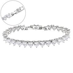 Introducing the Solstress "Diamond Heart Tennis Bracelet," a stunning piece that radiates elegance and romance. This bracelet showcases premium heart-shaped cubic zirconia stones, each sparkling with diamond-like brilliance. The sleek design and perfectly placed hearts create a timeless look that’s both sophisticated and sweet. Whether you're gifting it to someone special or treating yourself, the Diamond Heart Tennis Bracelet is the perfect accessory to add a touch of luxury and love to any outfit. Add the Solstress "Diamond Heart Tennis Necklace” to complete the set! Silver plated Water and tarnish-resistant Adjustable: 7in -7.5 in Luxury Formal Heart Jubilee Bracelet, Affordable Silver Heart Bracelet For Wedding, Elegant Luxury Heart-shaped Bracelet, Luxury Elegant Heart-shaped Bracelet, Luxury Heart Bracelet With Diamond Accents, Luxury Diamond Accented Heart Bracelet, Luxury Heart Bracelet With Diamond Accents For Anniversary, Luxury Heart-shaped Diamond Bracelet With Accents, Luxury Heart-shaped Diamond Bracelet