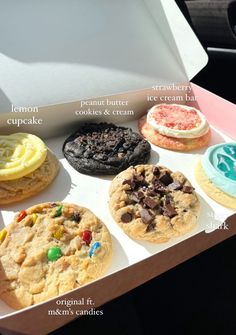 an open box filled with different types of cookies