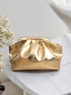 Let's take a look at the features of The Metallic Gold Clutch hand-crafted for your special invitation.  Crafted with metallic leather look fabric and satin lining. The Gold Clutch will come with a long detachable bag handle that you can use as a cross-body bag if you want.  See more of our and glossy clutchs here: https://www.etsy.com/shop/NaifCreativeStudio?ref=seller-platform-mcnav§ion_id=48788343 See the rest of our store here: https://www.etsy.com/shop/NaifCreativeStudio Designed for specia Cheap Gold Pouch Clutch, Cheap Pouch Bags With Gold-tone Hardware, Chic Pouch Cosmetic Bag For Formal Occasions, Elegant Formal Cosmetic Bag With Removable Pouch, Chic Gold Shoulder Bag For Wedding, Chic Formal Pouch Cosmetic Bag, Chic Formal Cosmetic Pouch Bag, Gold Evening Bag With Removable Pouch For Events, Gold Clutch With Removable Pouch For Evening