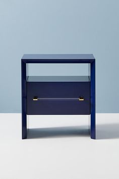 a blue table with two drawers on it