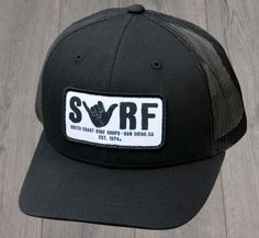 SURF SHAKA YOUTH HAT IS A PRE CURVED TRUCKER COTTON-TWILL MESH SNAPBACK. Black Fitted Trucker Hat, Fitted Black Trucker Hat, Fitted Black Trucker Snapback Hat, Black Fitted Trucker Snapback Hat, Black Flat Bill Trucker Hat For The Beach, Black Fitted Trucker Baseball Cap, Black Fitted Baseball Cap With Short Brim, Black Flat Bill Snapback Hat For Beach, Surf Shop