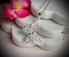 This a lovely necklace in 925 sterling silver with a cute Butterly as pendant hand crafted by us. Ideal as gift or for your fashion.  The chain is about 16" with an extended 2 more inches in case you need 18" as size.  The pendant is about 30x38 mm.  925 hallmark tag. It comes in a gift package. We aim to dispatch our orders in 24 hours using free 48 hours delivery but if you need your item quicker there is an option on the checkout for next day delivery for only £ 3.50. Elegant Silver Butterfly Necklace In Sterling Silver, Elegant Silver Butterfly Necklace Gift For Her, Delicate Sterling Silver Butterfly Necklace, Delicate Silver Sterling Silver Butterfly Necklace, Delicate Sterling Silver Butterfly Necklace In White Gold, Delicate White Gold Butterfly Necklace In Sterling Silver, Delicate White Gold Sterling Silver Butterfly Necklace, White Gold Necklace With Butterfly Charm, White Gold Necklace With Butterfly Charm In Sterling Silver