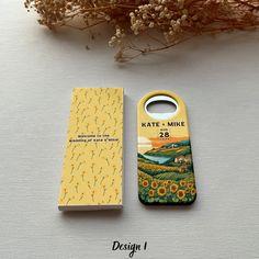 a bottle opener is sitting next to a box with a sunflower design on it