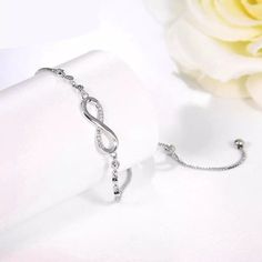 Minimalist Luxurious Crystal Bracelet Silver Color Adjustable Infinity Charm Bracelets for Women Fashion Jewelry Let this beautiful bracelet remind you or someone you love that they have value and infinite worth. Let someone know you will love them forever. This bracelet will make a great bridesmaid, anniversary, birthday, graduation, and Sweet 16 gift. Perfect for bridesmaid proposal too... **Nickle and lead-free   *Zinc Alloy Length .24 cm Weight 4.19 g Luxury Charm Bracelet For Anniversary, Valentine's Day, Luxury Silver Charm Bracelet For Valentine's Day, Luxury Silver Bracelet For Valentine's Day, Luxury Adjustable Bracelets For Valentine's Day, Luxury Infinity Bracelet As Gift, Luxury Charm Bracelet For Anniversary On Valentine's Day, Luxury Charm Bracelet For Anniversary And Valentine's Day, Luxury Minimalist Infinity Jewelry, Luxury Infinity Bracelets As Gift