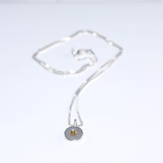 The fine chain gives the delicate pendant an extremely elegant impression. The warm yellowish color of the citrine shines particularly beautifully in the silver setting. The citrine (2.5 mm diameter) is set in a round disc. This is also silver 925 and has a diameter of 8 mm and is 2 mm thick. The blank plus the eyelet measure 13 mm long. The chain is made of silver 925. It is 42 cm long and has a diameter of 1 mm. If you would like a longer chain, please send me a message. According to § 19 UStG Delicate Pendant, Citrine Pendant, Long Chain, Silver 925, Citrine, Favorite Jewelry, Charm Necklace, Silver Chain, Beauty Book