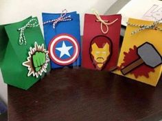 some avengers themed bags are sitting on a table