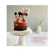 a cake with mickey and minnie mouse on it