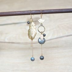 Bird and feather mismatched earrings, matt gold plated over brass, high quality, 925 sterling silver gold plated ear hook. With multi shape of labradorite gemstone, ie 4mm faceted round bead, 6mm round bead & 10mm coin shape bead. Also with Dark Grey fresh water pearl and size is approx 4-5mm. Total length of these earrings is approx 71mm(bird side) and 75mm(feather side). **Important - the labradorite gemstone is natural stone, so natural cracked pattern maybe appeared. Each labradorite is uniq Grey Earrings, Disney Earrings, Gray Earrings, Seashell Earrings, Asymmetrical Earrings, Mermaid Earrings, Ear Earrings, Mismatched Earrings, Fresh Water Pearl