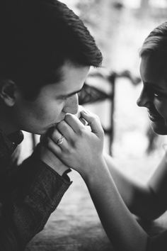 a man and woman are touching each other's foreheads with the caption in arabic