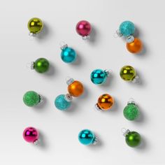 an assortment of christmas ornaments on a white background with space for your text or image