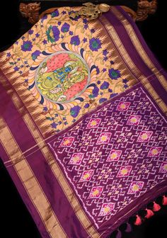 This silk saree showcases stunning Radha Krishna designs, expertly created using the highly desirable Kalamkari technique and incorporating traditional Pichwai elements. The intricate hand-painted motifs in soothing shades of sandle and purple stand out against a backdrop of delicate floral vines. The Ikkat pallu and Stack border add an element of refinement to this magnificent piece, making it a truly exceptional creation. SILK MARK CERTIFIED This saree is ready to wear with fall and pico done. Handmade silk tassels adorn the pallu and add more grace to it. An unstitched blouse fabric is included. *Note: There may be minor variations in the shade, the texture of the product. Hues/textures show differently due to variations in screen settings and other factors, *Note: This is a handwoven s Pichwai Elements, Radha Krishna Design, Krishna Design, Beige Saree, House Of Blouse, Divine Beauty, Saree Blouses, Pure Silk Saree, Dyeing Techniques