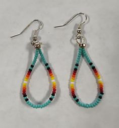 Lightweight beaded earrings that is very versatile. Bohemian Adjustable Teardrop Earrings With Colorful Beads, Beaded Teardrop Jewelry For Gifts, Adjustable Bohemian Teardrop Earrings With Colorful Beads, Dangle Teardrop Earrings With Tiny Beads As Gift, Southwestern Dangling Beads For Jewelry Making, Multicolor Teardrop Jewelry With Colorful Beads, Gift Teardrop Dangle Earrings With Tiny Beads, Adjustable Multicolor Beaded Teardrop Earrings, Adjustable Beaded Dangle Hoop Earrings