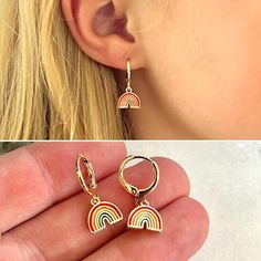 Cute mini gold rainbow hoop huggie earrings for children!  These colorful rainbow 18k gold plated small hoop earrings make the perfect gift for your little girl.  Hinge closure for easy on/off.   D E T A I L S: -Children's colorful mini rainbow hoop huggie earrings -14mm size -Stainless Steel, 18k gold plated -Trendy, minimalist design -Perfect for any occasion! V I E W - O U R - O T H E R - K I D S - J E W E L R Y: https://www.etsy.com/shop/JewelryVV?section_id=22076012 See all of our designs: Baby Earrings, Mini Gold, Girl Rainbow, Huggie Earrings, Birthday Gifts For Kids, Hoop Earrings Small, Jewelry Earrings Hoops, Huggies Earrings, Toddler Girl