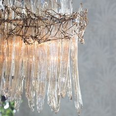 a chandelier hanging from a ceiling with lots of glass beads attached to it