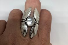 Lovely polished sterling silver has the look of Deco with a huge white Mother Of Pearl inlaid Lunar moth very detailed vintage filigree We can size these with an additional $20 fee for the jeweler All rings are shipped in a nice gift box. Check out our over a THOUSAND great reviews!!! Engraving is $4 per letter and is not always perfect depending on the piece. It can take a few days if the jeweler is busy. This is payable to Paypal Judithsltd@gmail.com White Art Deco Jewelry With Intricate Design, White Sterling Silver Art Deco Jewelry, Unique White Moonstone Ring, Unique White Jewelry With Polished Finish, White Art Deco Ring Jewelry, White Art Deco Ring, Vintage Silver Moonstone Ring With Polished Finish, Elegant Engraved Silver Moonstone Ring, Elegant White Sterling Silver Butterfly Ring