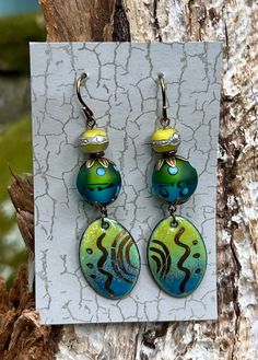 Handmade Enamel Drop Earrings Lampwork Beads made by Diana Bloomfield Lampwork Spacer Bead made by Kate Holmes Enamel Drop made by Jan Cahill Tarnish Resistent Bronze Components Artistic Multicolor Round Bead Earrings, Green Hand-painted Bohemian Earrings, Green Hand Painted Bohemian Earrings, Artisan Green Czech Glass Earrings, Bohemian Green Enamel Earrings, Green Artisan Enamel Earrings, Artisan Green Enamel Earrings, Green Artisan Round Bead Earrings, Artisan Green Beaded Earrings Nickel Free