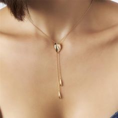 Introducing our 18K Gold-Plated Tie Necklace with Zirconias — a statement of refined elegance and timeless glamour. Versatile and chic, this piece effortlessly elevates any ensemble, making it the perfect accessory for both casual and formal occasions. 15.75in + 2in extender 40CM + 5CM Luxury White Lariat Necklace For Gift, Elegant Formal Chain Necklace With Adjustable Chain, Modern Gold Plated Necklaces, Modern Gold-plated Necklaces, Gold-tone Clavicle Chain Jewelry For Wedding, Elegant Chain Necklace As Gift, Formal Long Necklace With Clavicle Chain, Elegant Plated Chain Necklace Gift, Elegant Gold Plated Chain Necklace With Adjustable Chain