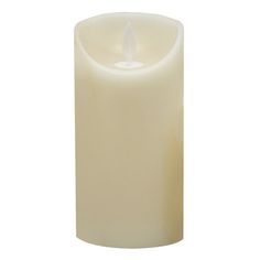 a white candle is lit on a white background